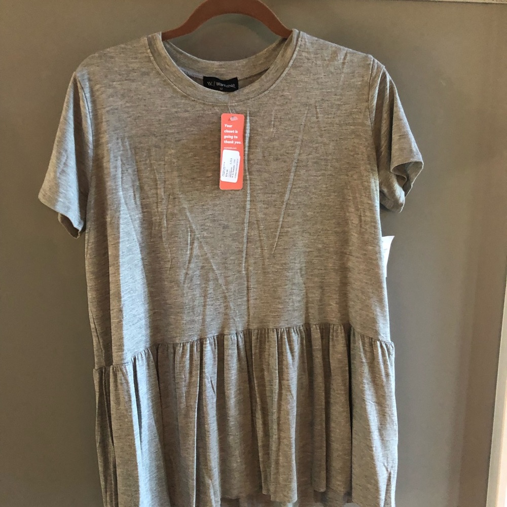 NWT size medium short sleeved peplum top